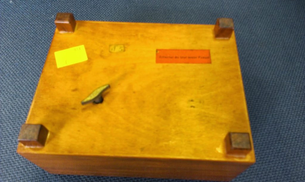 music box - base of the box has a label and a key