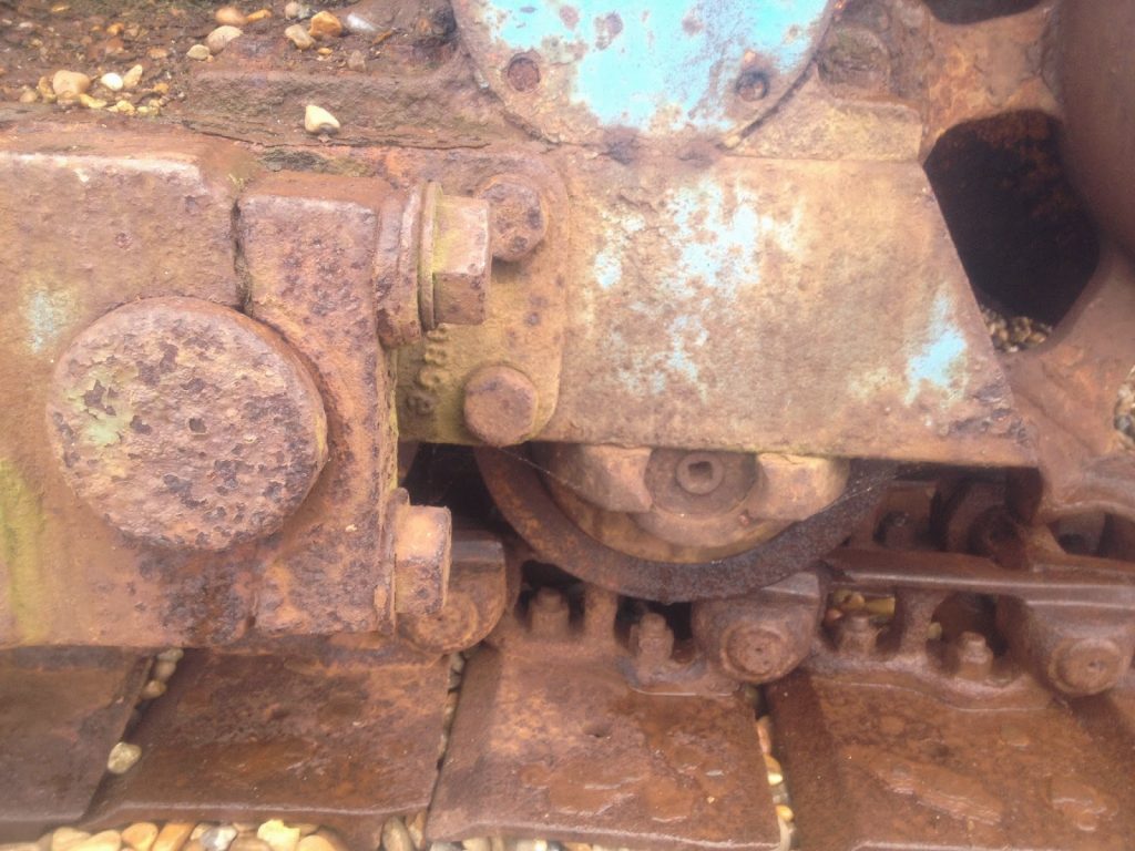 Rust on the beach - metal tractor tracks