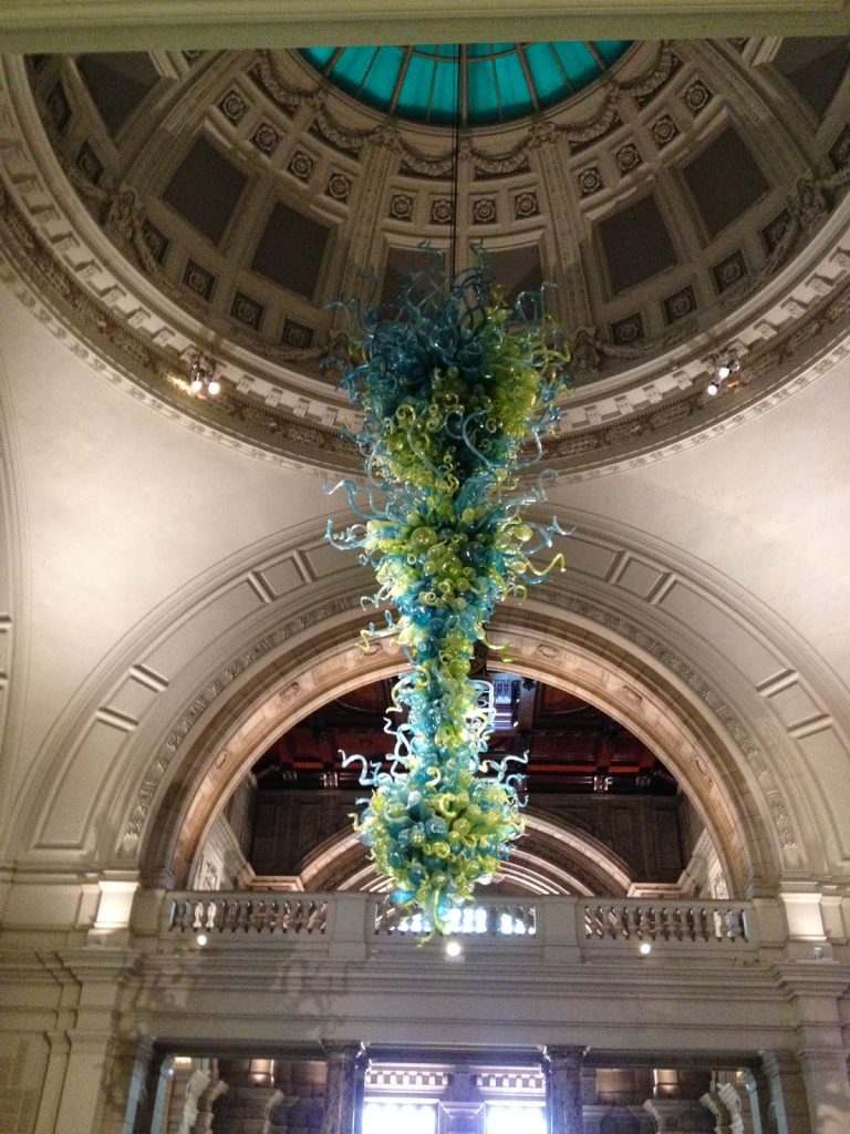 Glass sculpture by Dale Chihuly hangs from the dome over the entrance