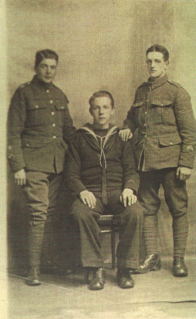 World War one - My Grandfather is sitting in the middle wearing his naval uniform. His friends are standing either side in army uniform.