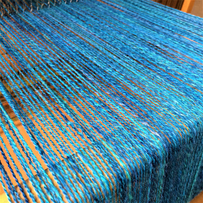 Wool threads on weaving loom