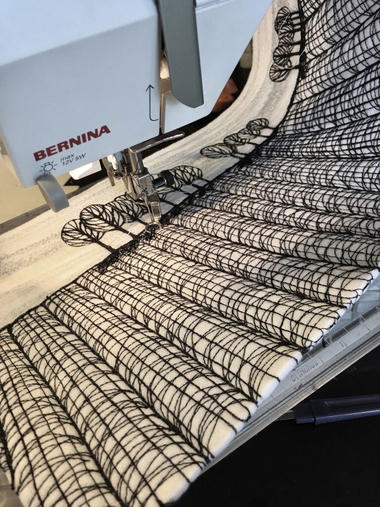 Work in Progress by Sue Nicholls - and embroidered landscape being machine stitched on a Bernina sewing machine