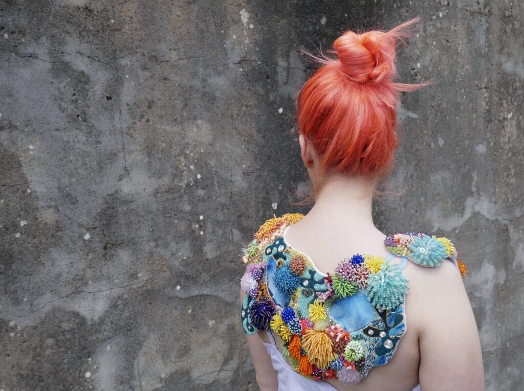 Heavily beaded collar inspired by the textures and colours of the Coral Reefs - created by Claire Edwards