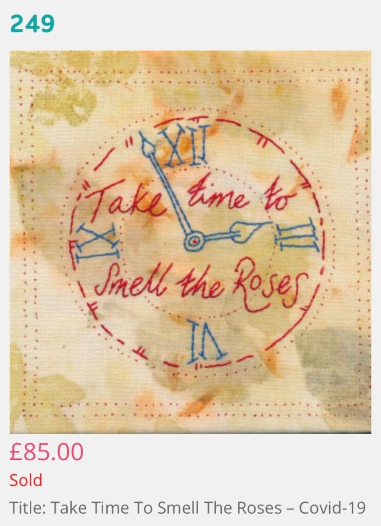 Eco printed cotton cloth with garden leaves. Hand embroidered clock face saying Take time to Smell the Roses