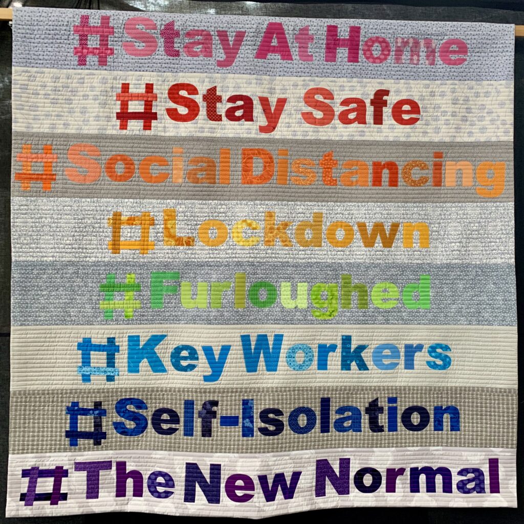 patchwork quilt with words with hashtags stayathome, staysafe, keyworkers, 