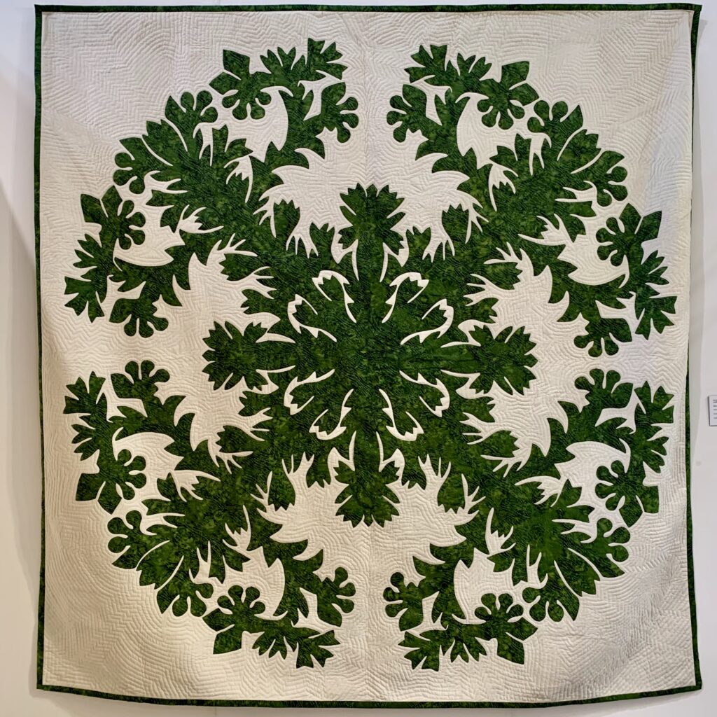 Green on cream Hawaiian quilt by Pippa
