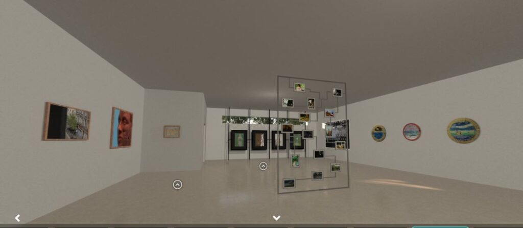 Inside modern looking exhibition space - art of all kinds on the white walls