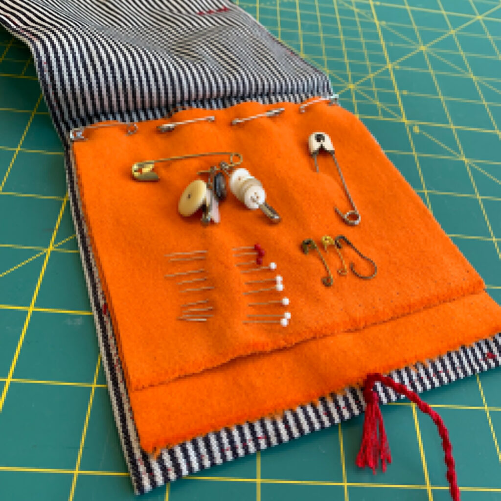 orange pages of cloth for pins