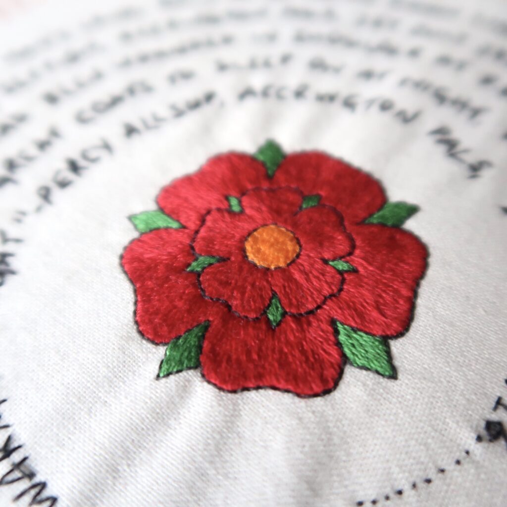 A Lancashire Rose takes centre stage in the hand embroidered piece