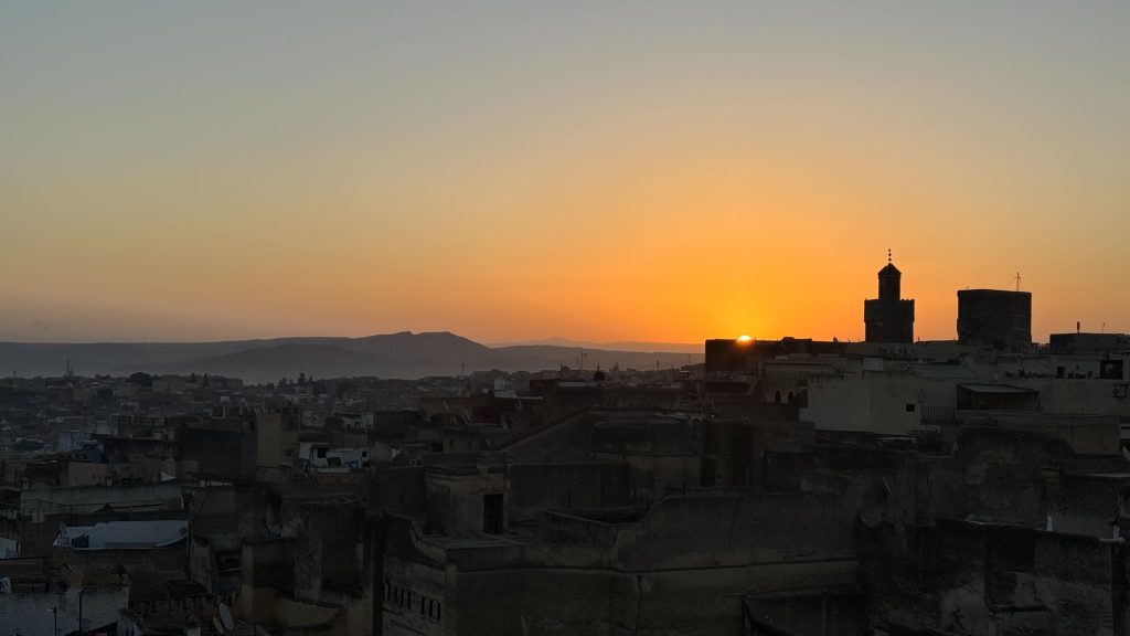 Experience the morning call of prayer and sunrise over the city of Fes