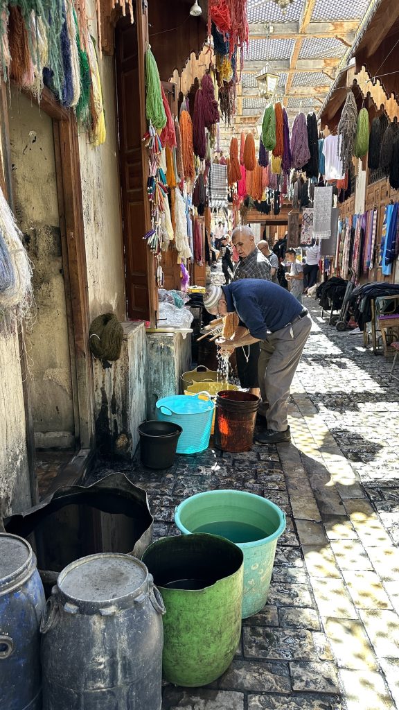 Visit the colourful street of dyers - processing wool and cloth for local artisans